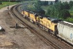 Westbound grain train eases uphill